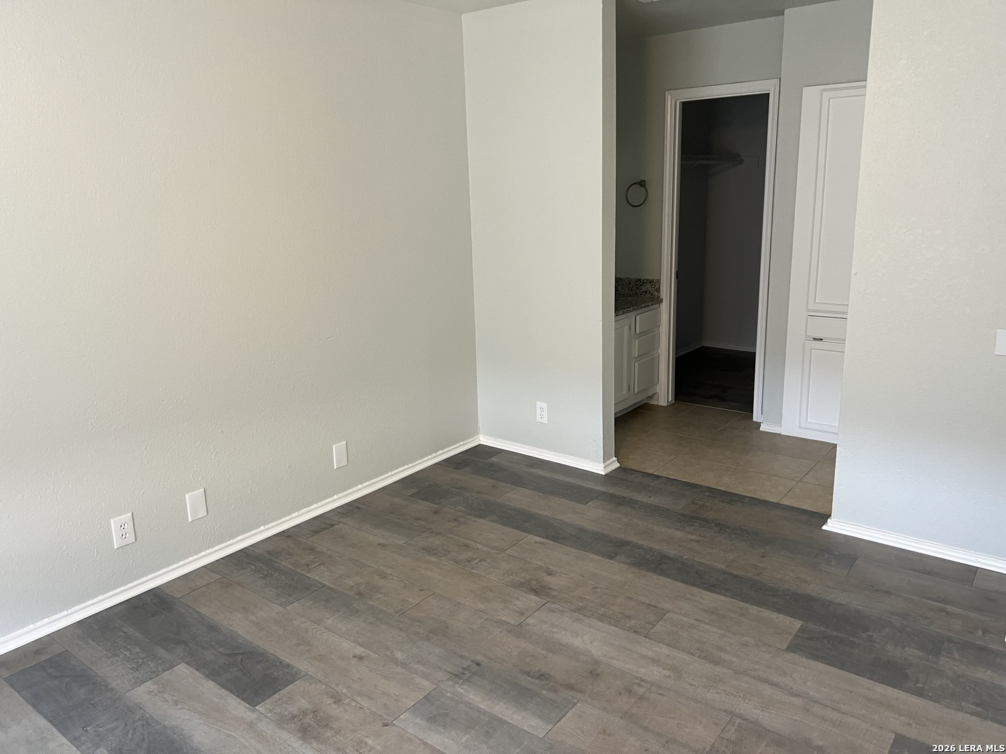 108-110 Whisper Way Boerne, TX 78006 - Photo 6 of 15 an empty room with wooden floor and entrance