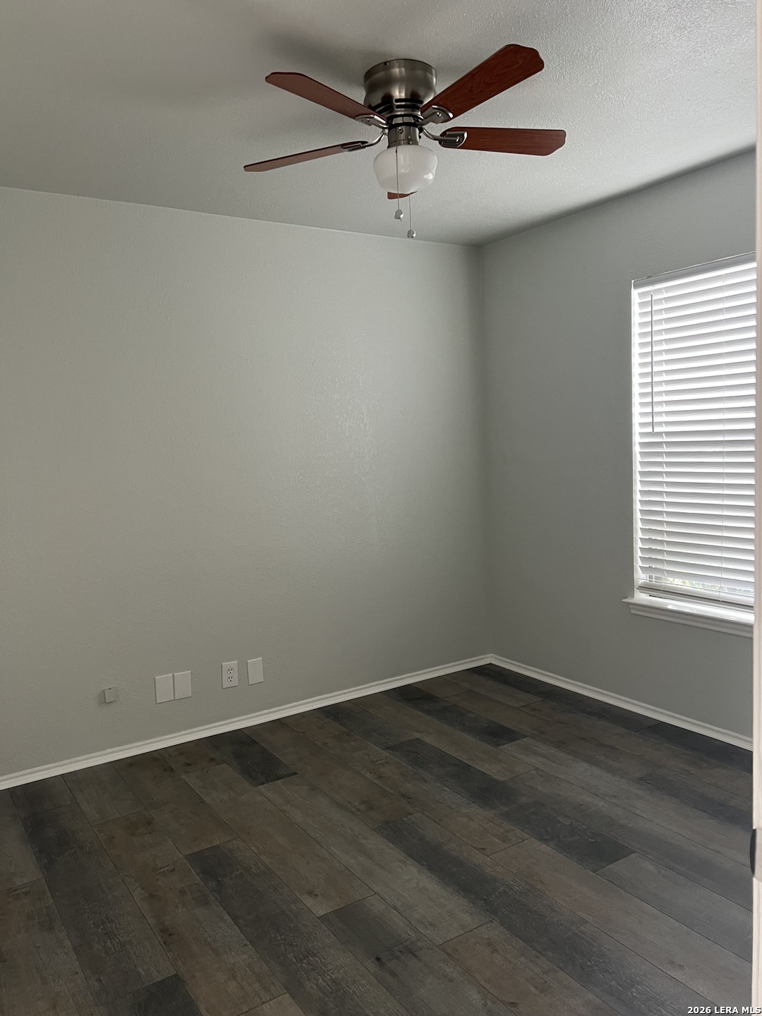 108-110 Whisper Way Boerne, TX 78006 - Photo 10 of 15 an empty room with a window and a ceiling fan