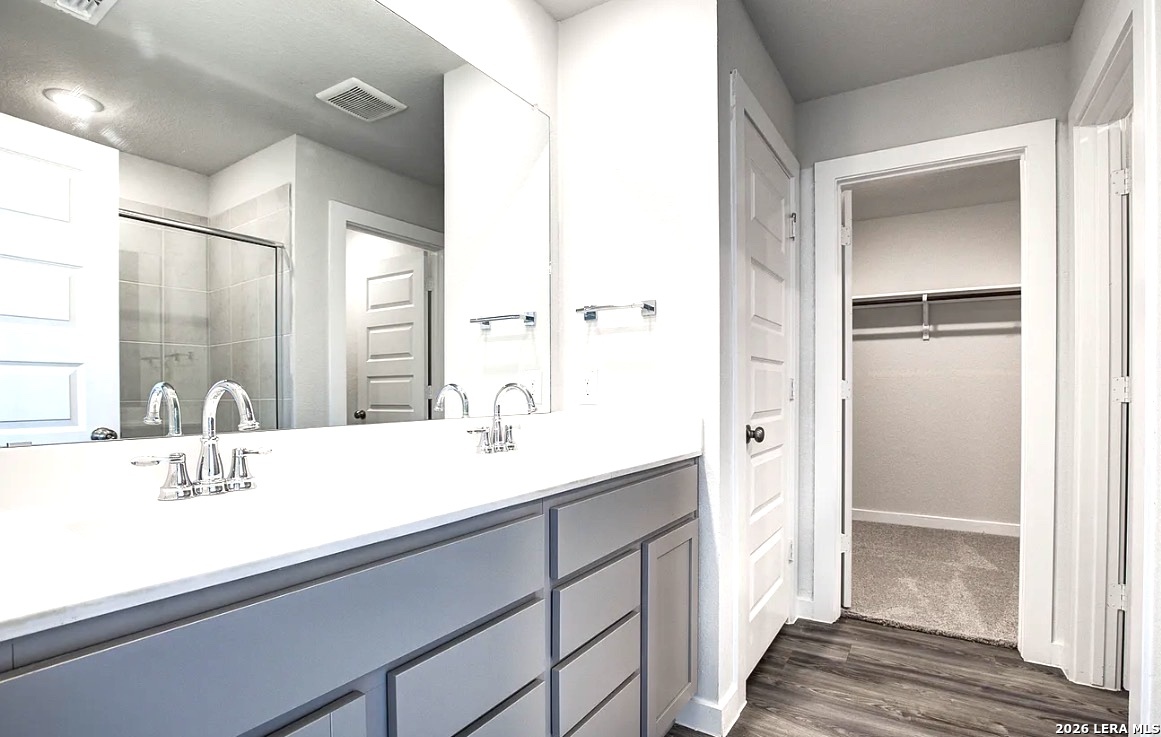 2563 Rambo Drive San Antonio, TX 78224 - Photo 13 of 21 a bathroom with a sink and a mirror