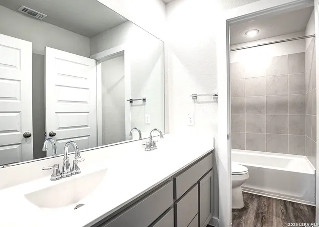 a bathroom with a sink and a mirror