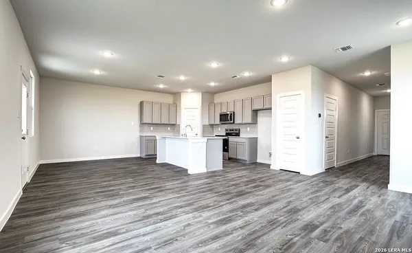 a view of kitchen with wooden floor