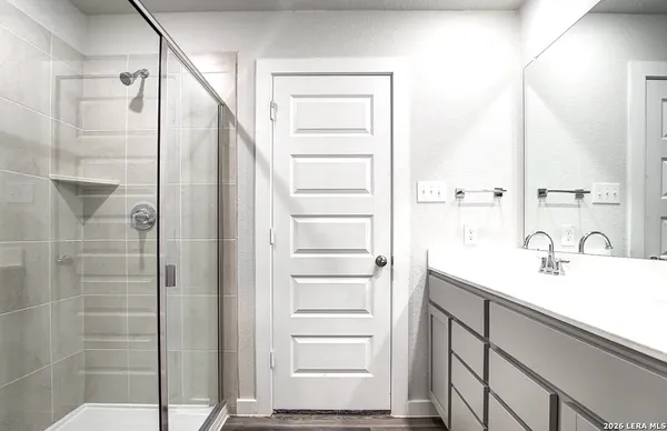 a bathroom with a sink and a mirror