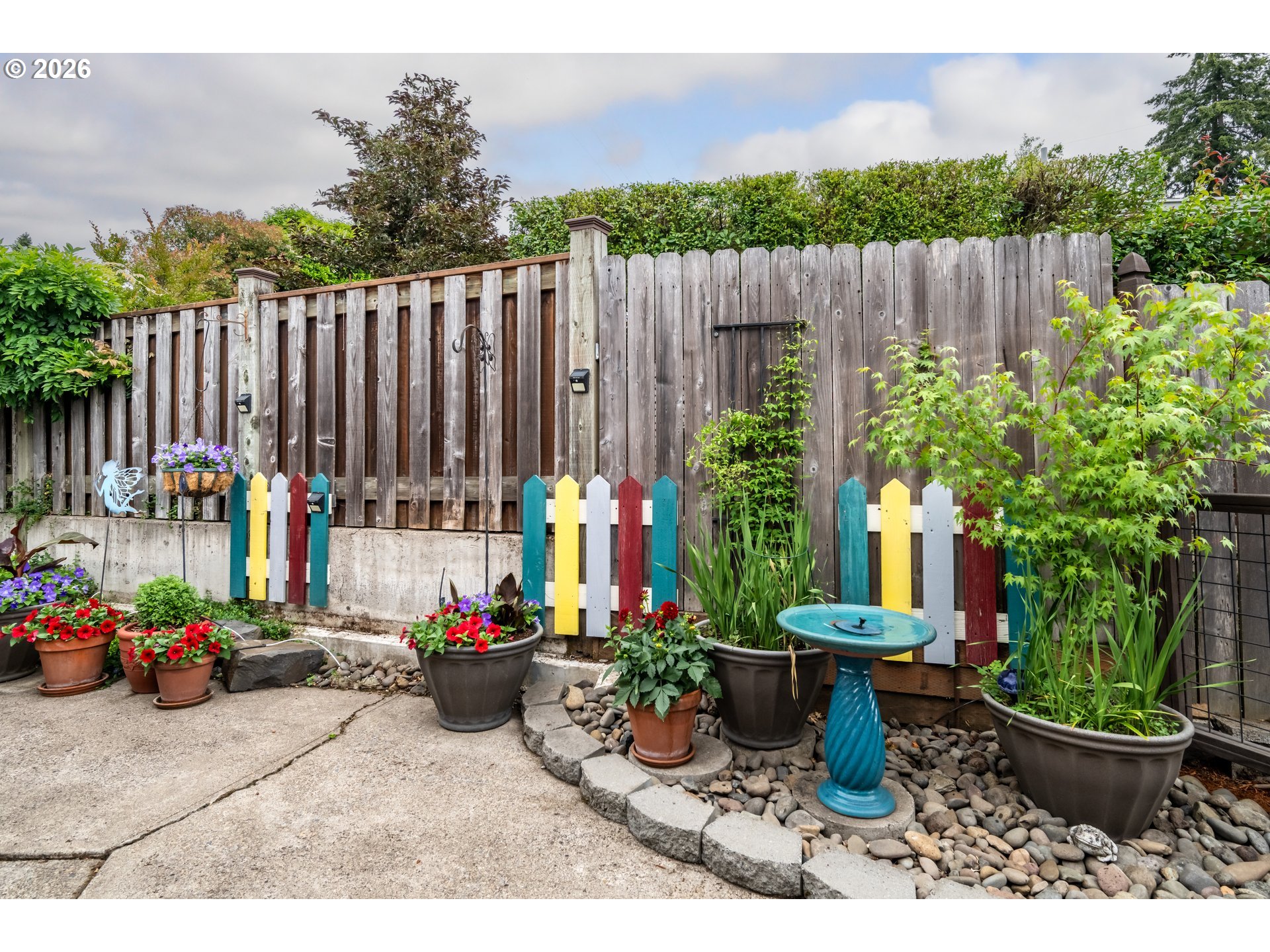 420 Riverview Boulevard Springfield, OR 97477 - Photo 20 of 28 a view of a backyard with sitting area and potted plants