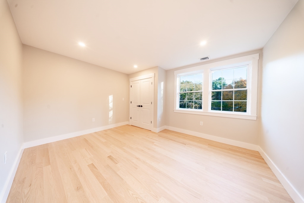292 Main Street Norfolk, MA 02056 - Photo 23 of 42 a view of an empty room with a window