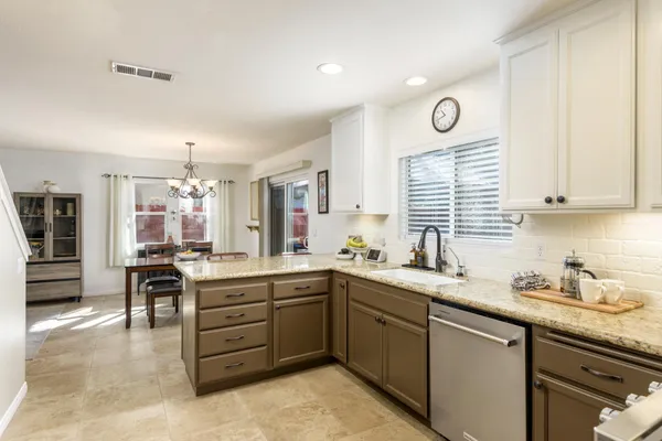 a kitchen with lots of counter top space sink stove and cabinets