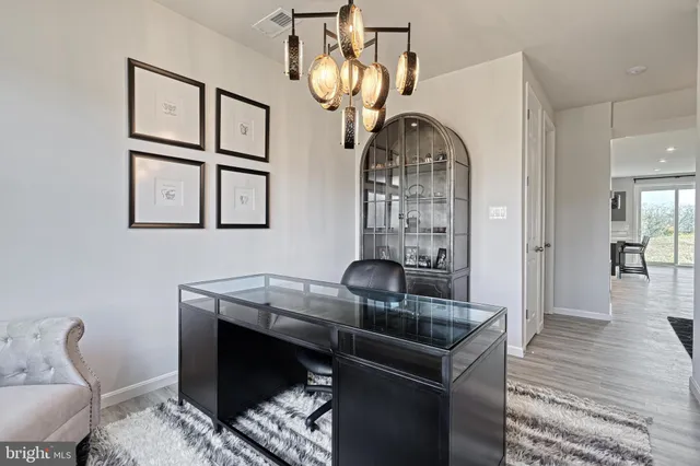 a view of dining room kitchen with furniture and stainless steel appliances