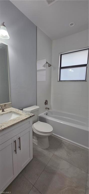 598 2nd Street Southeast Naples, FL 34117 - Photo 25 of 40 Full bathroom featuring vanity, shower / bath combination, and light tile patterned floors