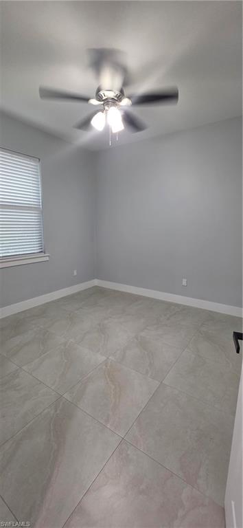 598 2nd Street Southeast Naples, FL 34117 - Photo 27 of 40 Unfurnished room with baseboards and ceiling fan