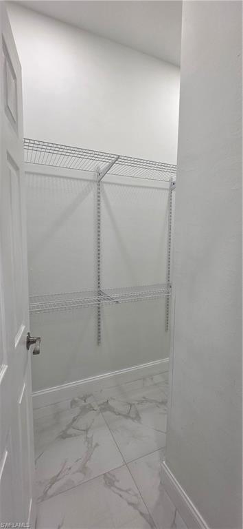 598 2nd Street Southeast Naples, FL 34117 - Photo 29 of 40 Spacious closet featuring light marble finish floors