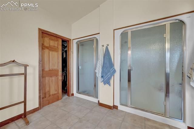23025 Fix Run Point Calhan, CO 80808 - Photo 22 of 41 Primary Bathroom w/ dual showers & walk-in closet on left