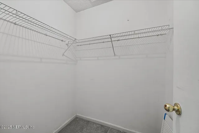 a view of a room with racks on the wall