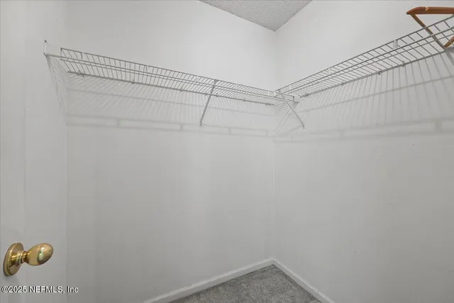 a view of a room with racks on the wall