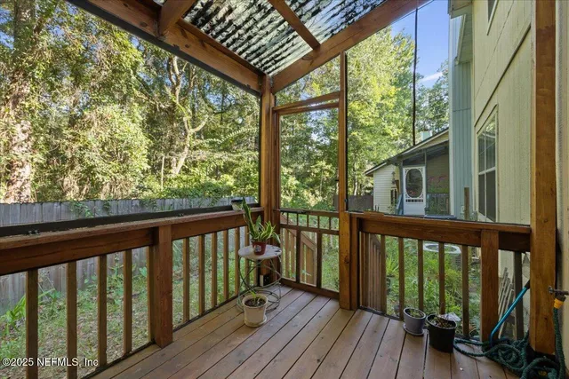 a view of balcony with wooden floor