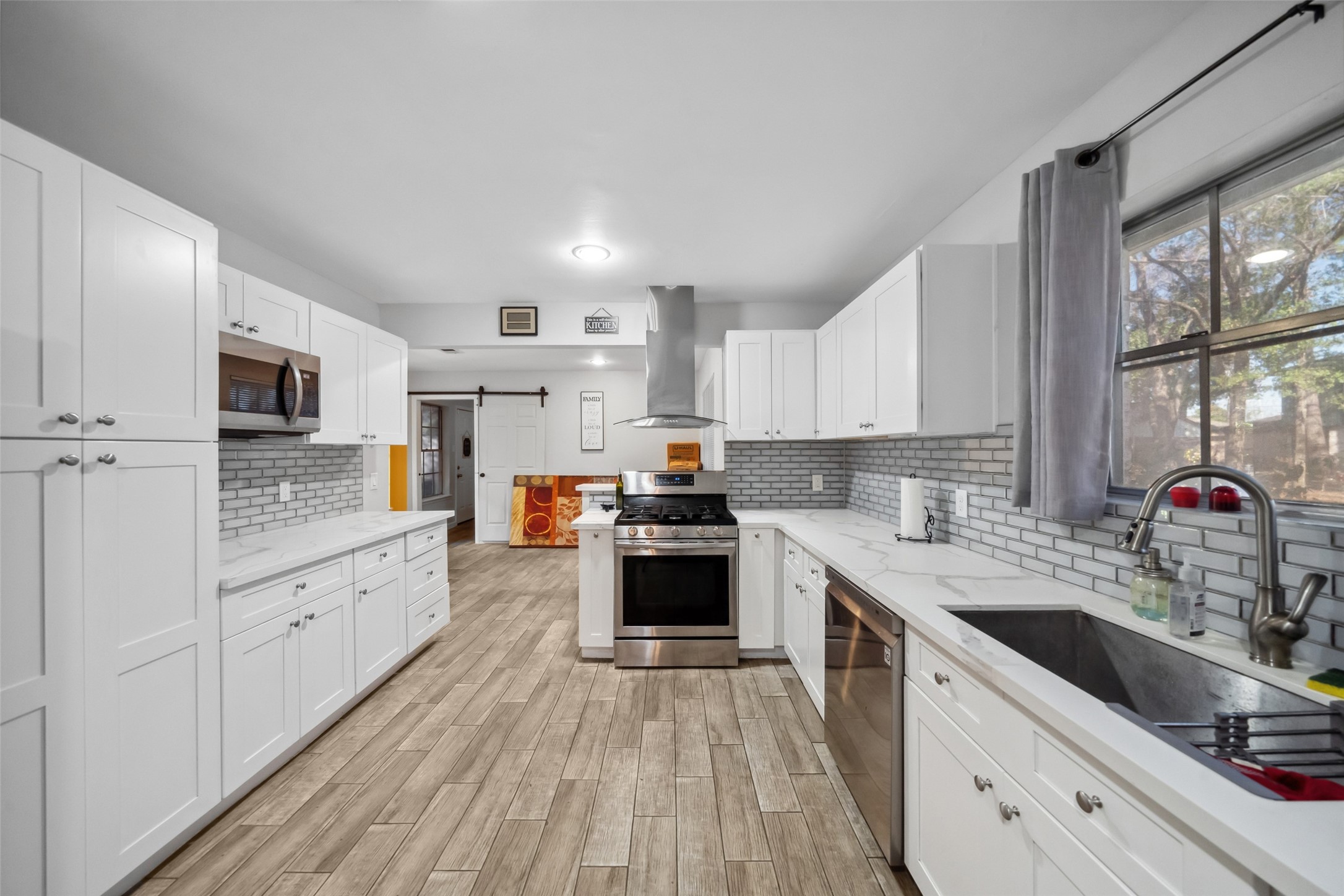 202 Black Forest Drive Spring, TX 77388 - Photo 11 of 26 QUARTZITE KITCHEN COUNTERS AND CONNECTED ISLAND AREA