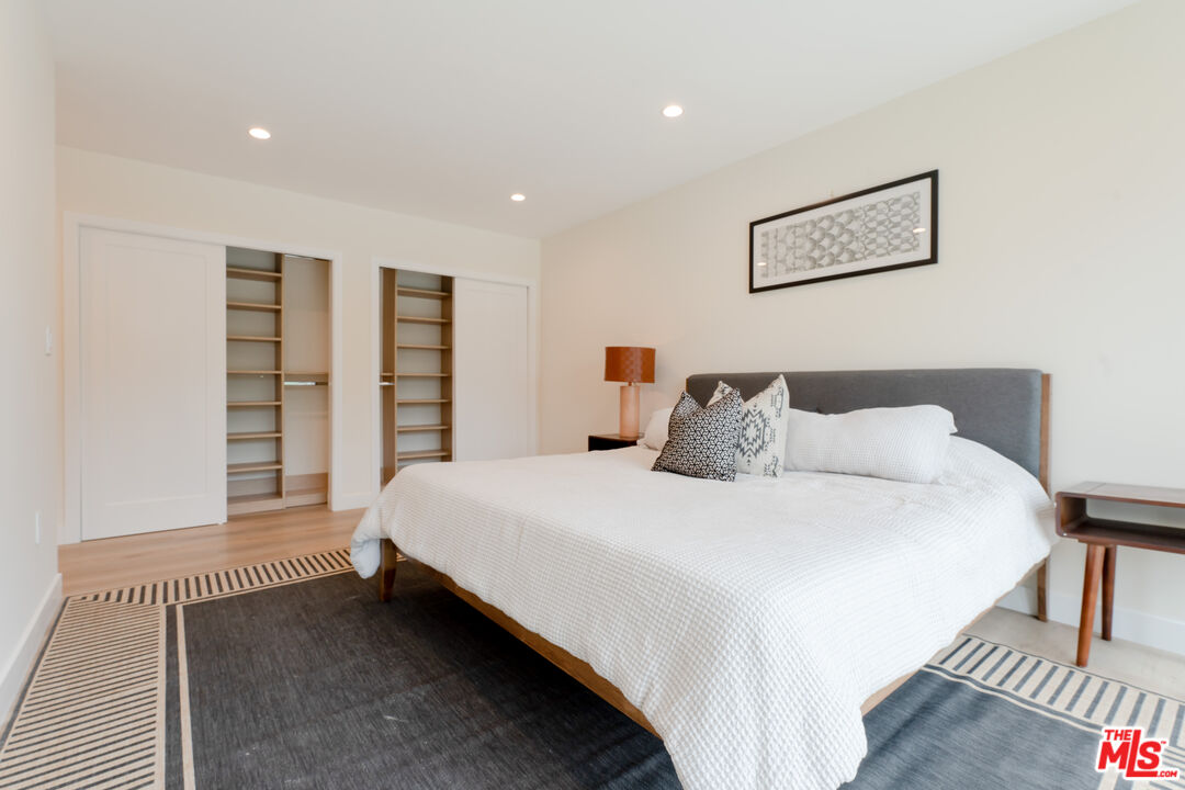 842 North Alfred Street, Unit 1 Los Angeles, CA 90069 - Photo 14 of 14 a spacious bedroom with a bed and a window
