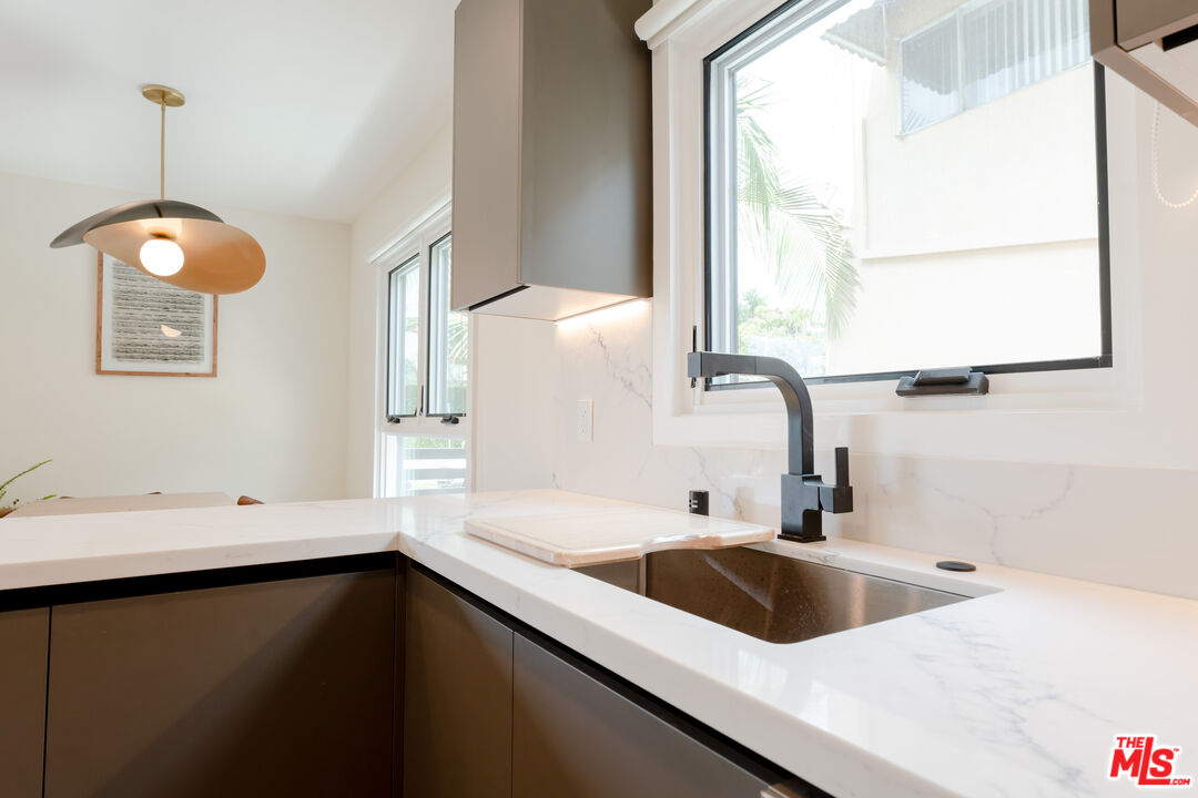 842 North Alfred Street, Unit 1 Los Angeles, CA 90069 - Photo 3 of 14 a kitchen with a sink and a window