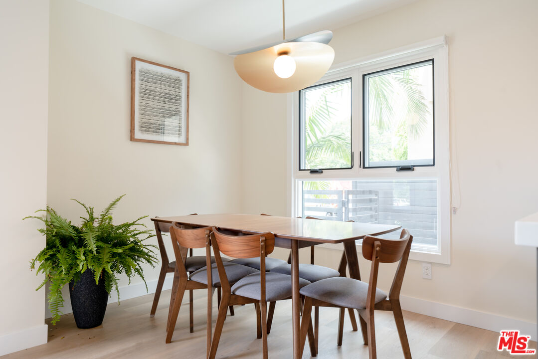 842 North Alfred Street, Unit 1 Los Angeles, CA 90069 - Photo 5 of 14 a dining room with furniture and window
