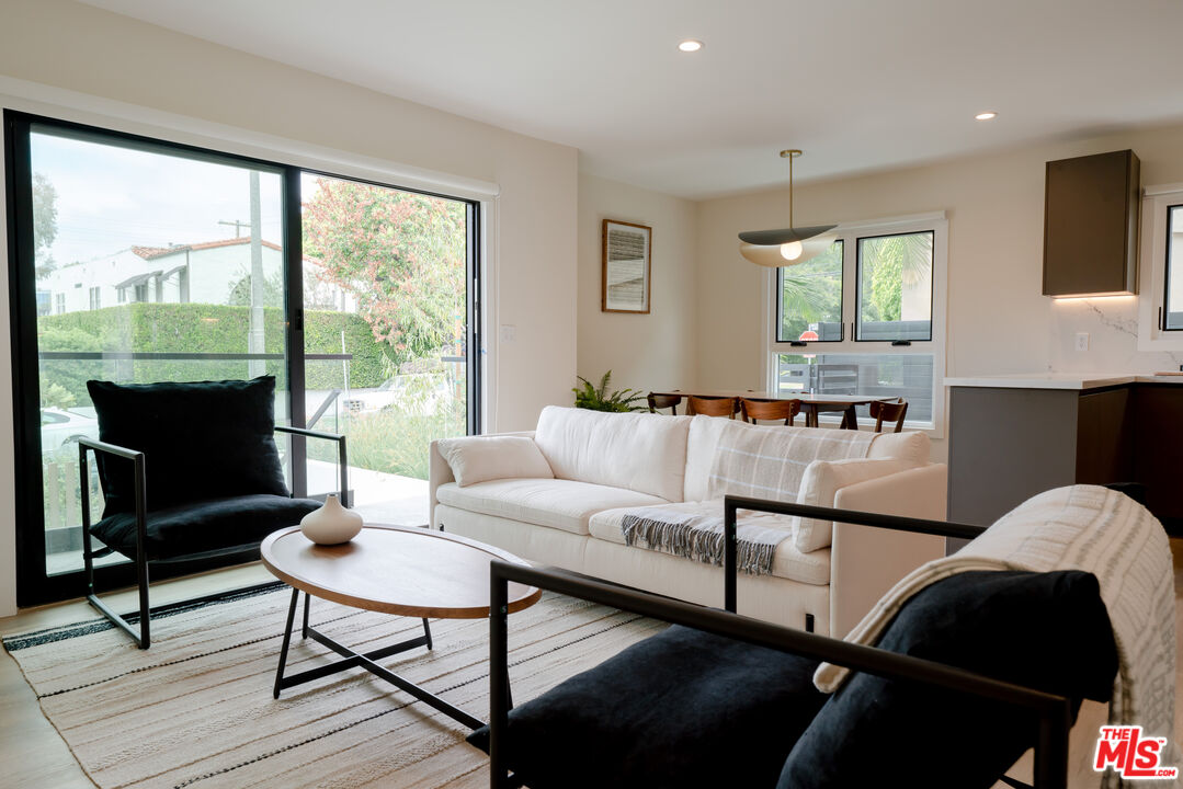 842 North Alfred Street, Unit 1 Los Angeles, CA 90069 - Photo 6 of 14 a living room with furniture and a fireplace