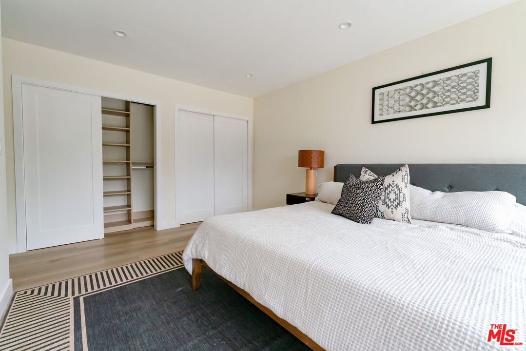 842 North Alfred Street, Unit 1 Los Angeles, CA 90069 - Photo 10 of 14 a bedroom with a bed and a walk in closet