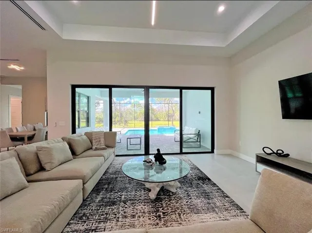 a spacious bedroom with a bed and a large window