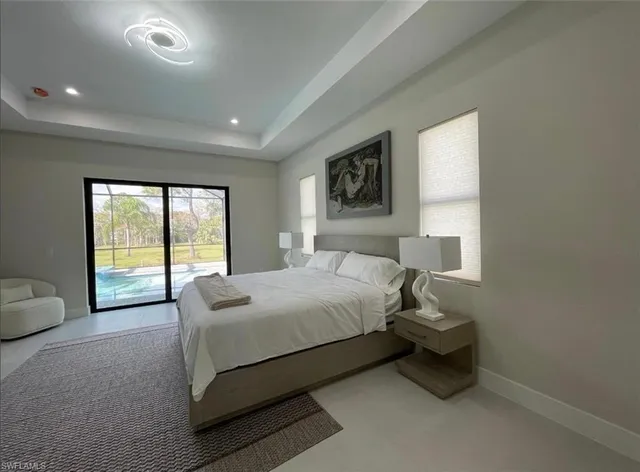 a view of a house with backyard and a patio