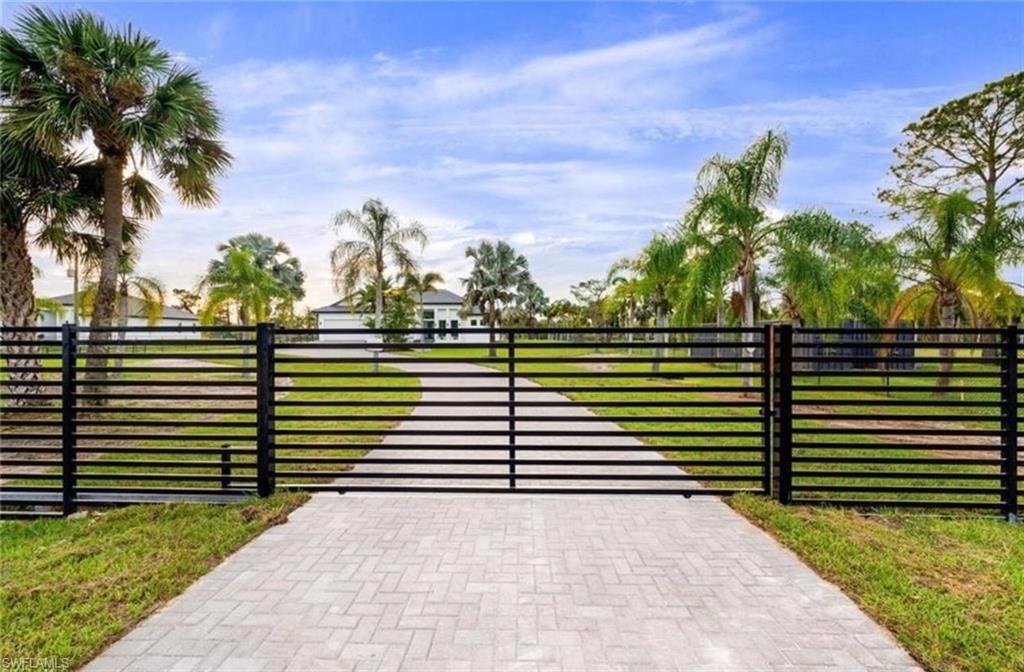 687 23rd Street Southwest Naples, FL 34117 - Photo 3 of 40 Gate with a yard