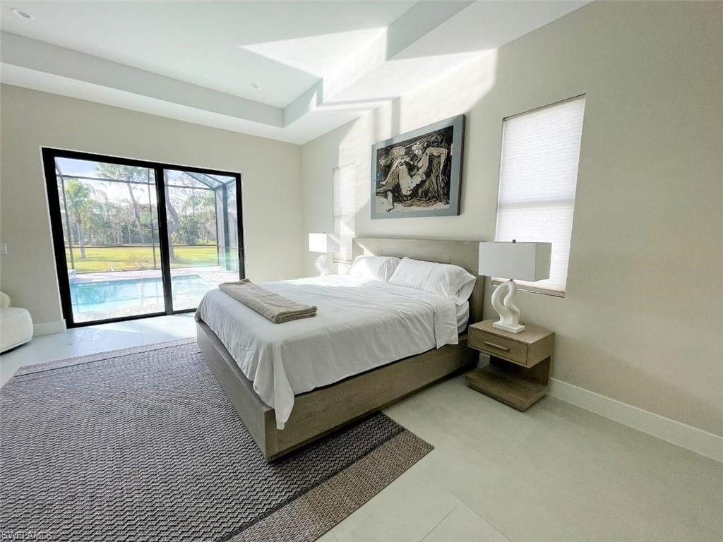 687 23rd Street Southwest Naples, FL 34117 - Photo 37 of 40 Bedroom featuring access to outside and baseboards