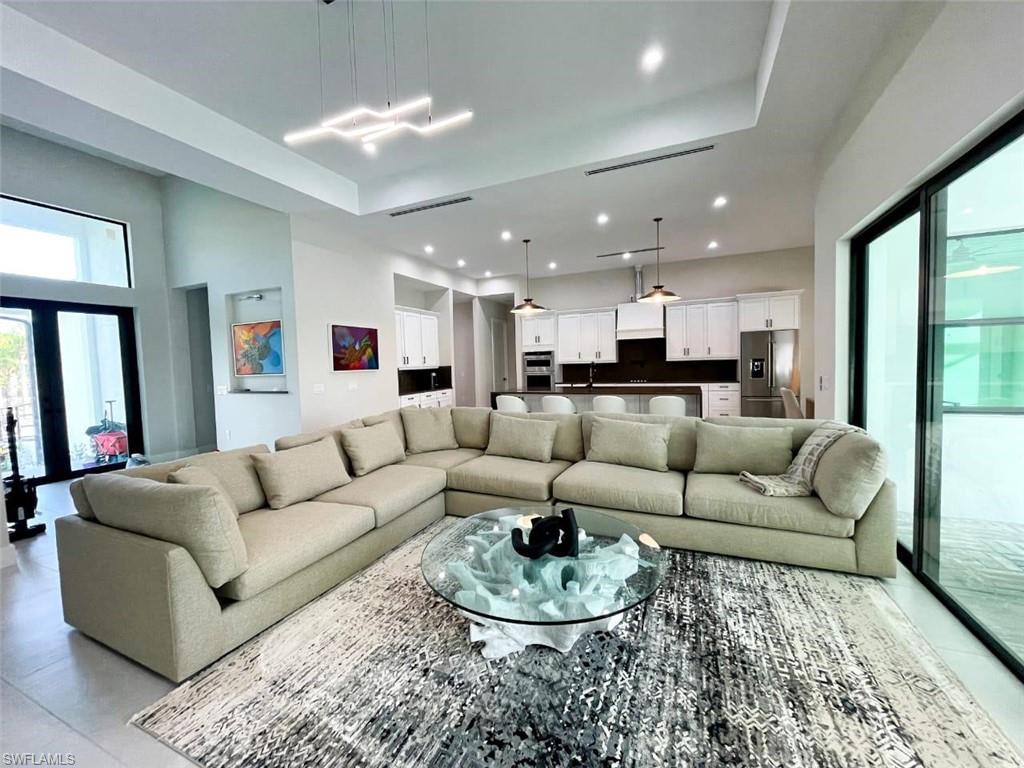 687 23rd Street Southwest Naples, FL 34117 - Photo 39 of 40 Living area with recessed lighting and a towering ceiling