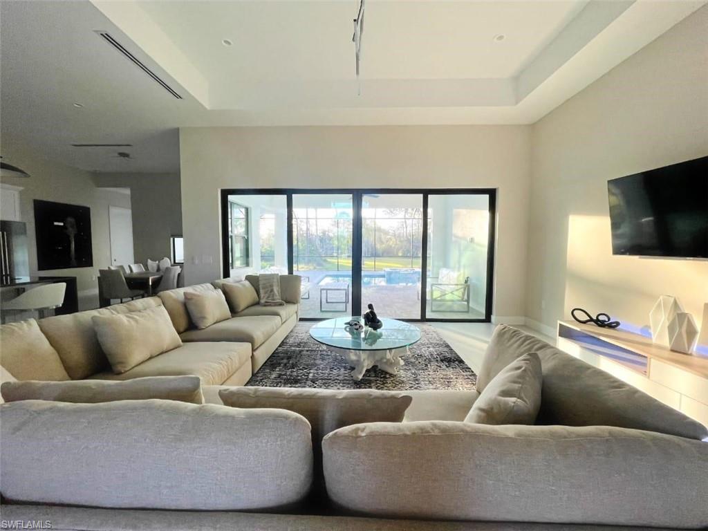 687 23rd Street Southwest Naples, FL 34117 - Photo 40 of 40 Living area with a raised ceiling