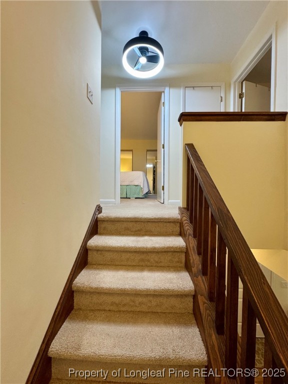 165 Springberry Lane, Unit 165 Chapel Hill, NC 27517 - Photo 16 of 41 a view of staircase with white walls and a window