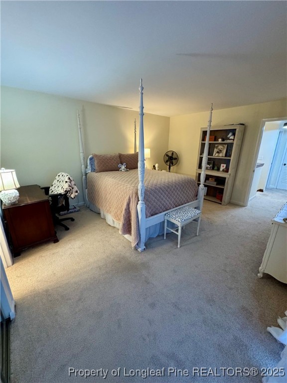 165 Springberry Lane, Unit 165 Chapel Hill, NC 27517 - Photo 20 of 41 a spacious bedroom with a bed and dresser