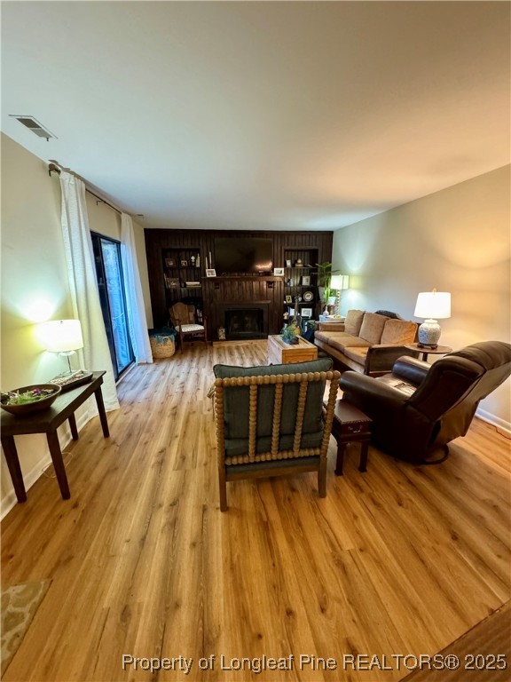 165 Springberry Lane, Unit 165 Chapel Hill, NC 27517 - Photo 2 of 41 a living room with furniture and a flat screen tv