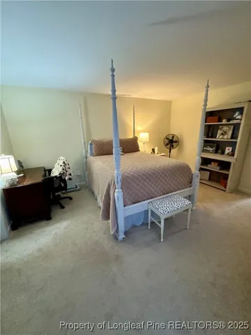 a bedroom with bed and window