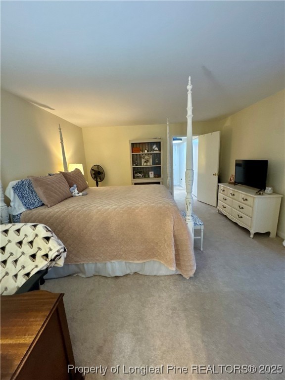 165 Springberry Lane, Unit 165 Chapel Hill, NC 27517 - Photo 22 of 41 a spacious bedroom with a bed and couch