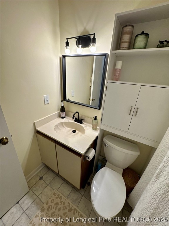 165 Springberry Lane, Unit 165 Chapel Hill, NC 27517 - Photo 26 of 41 a bathroom with a toilet sink and mirror