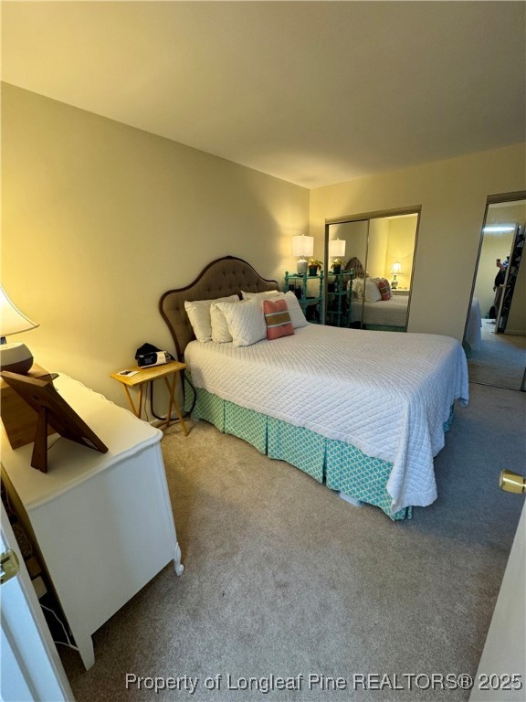 165 Springberry Lane, Unit 165 Chapel Hill, NC 27517 - Photo 27 of 41 a bedroom with a bed and window