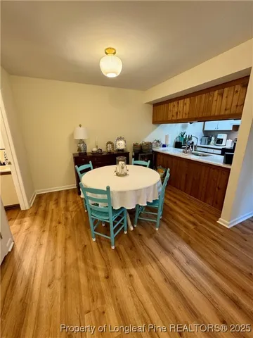 a dining room with a table and chairs
