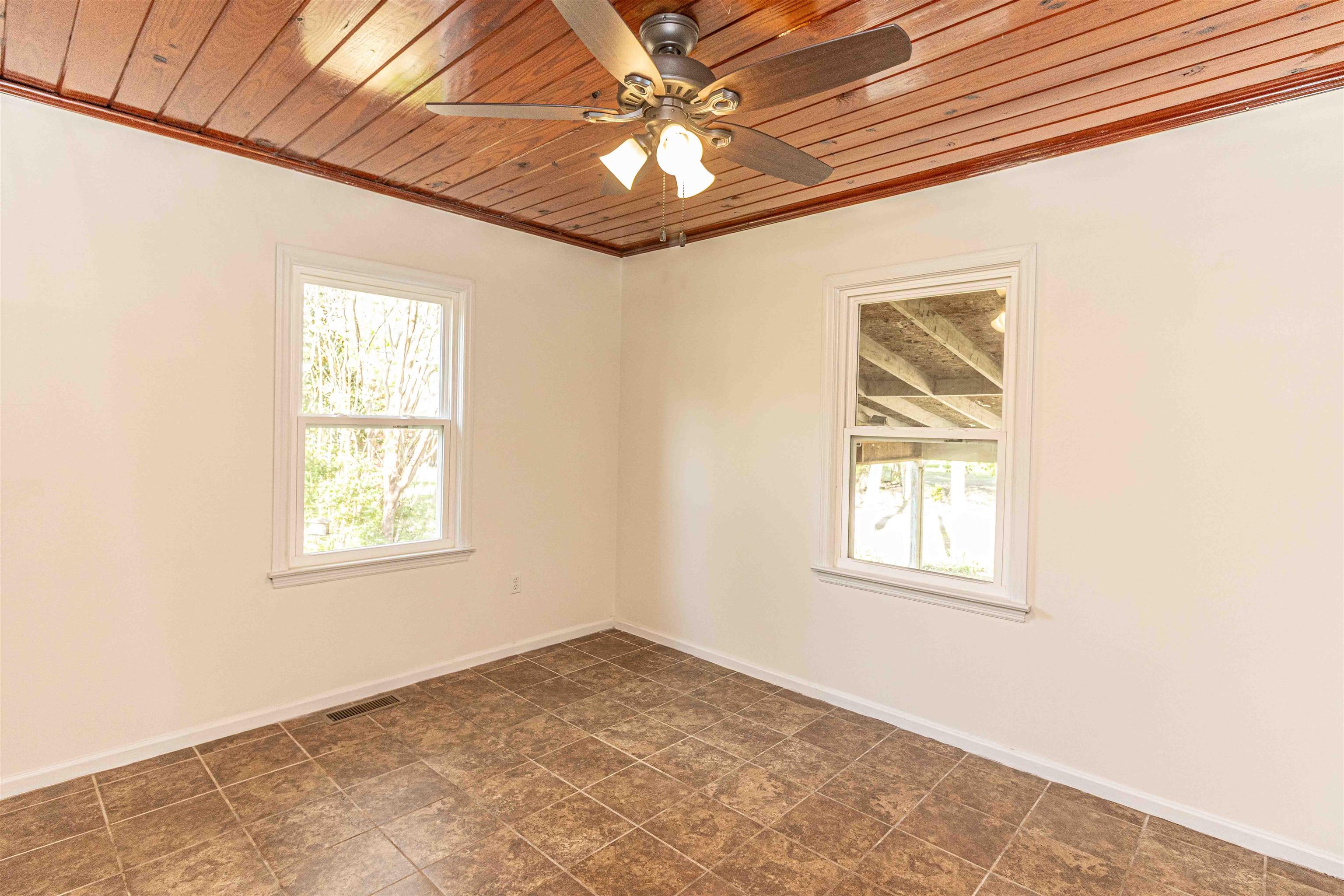212 North Maple Street Adamsville, TN 38310 - Photo 15 of 25 an empty room with windows