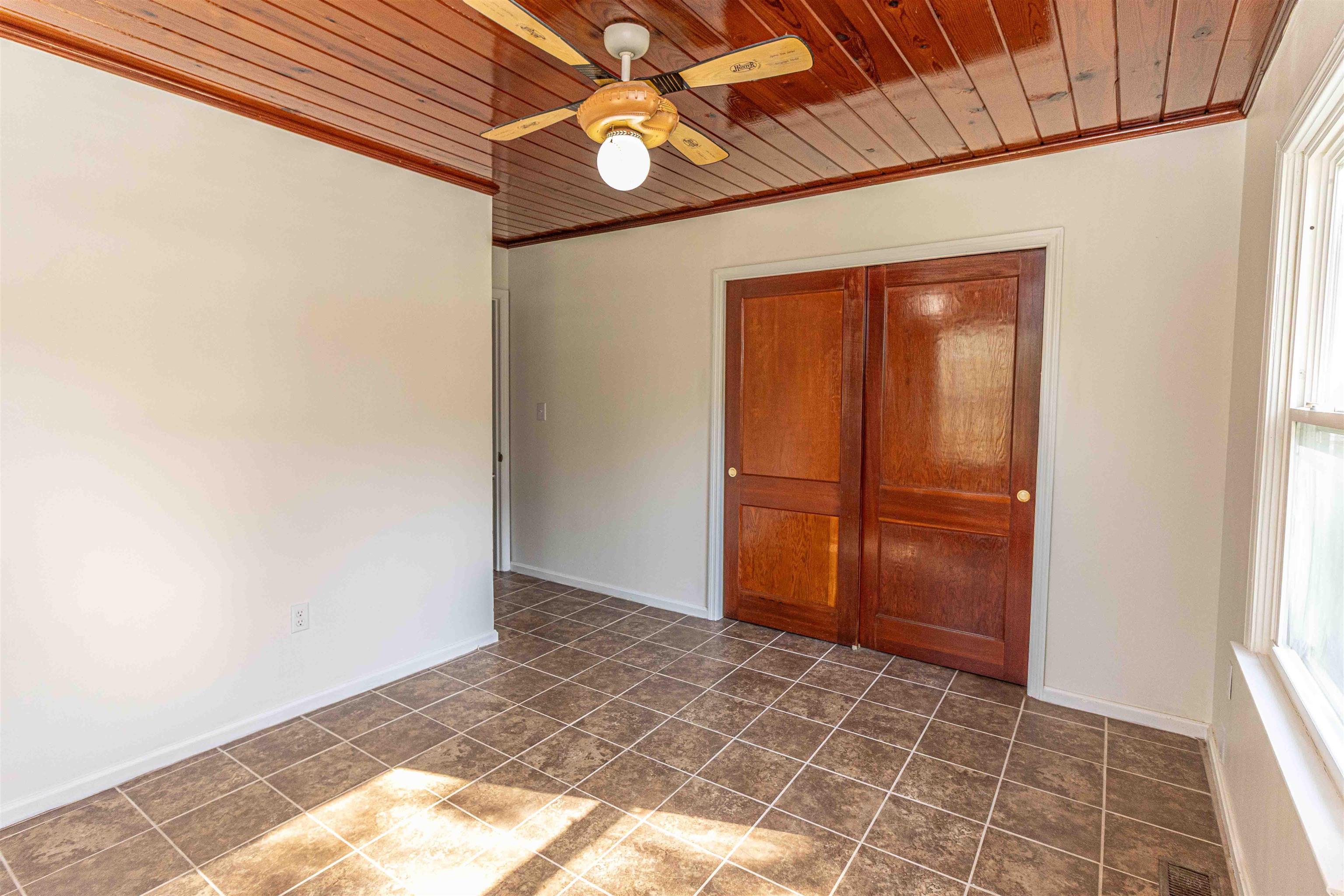 212 North Maple Street Adamsville, TN 38310 - Photo 18 of 25 a view of an empty room and window