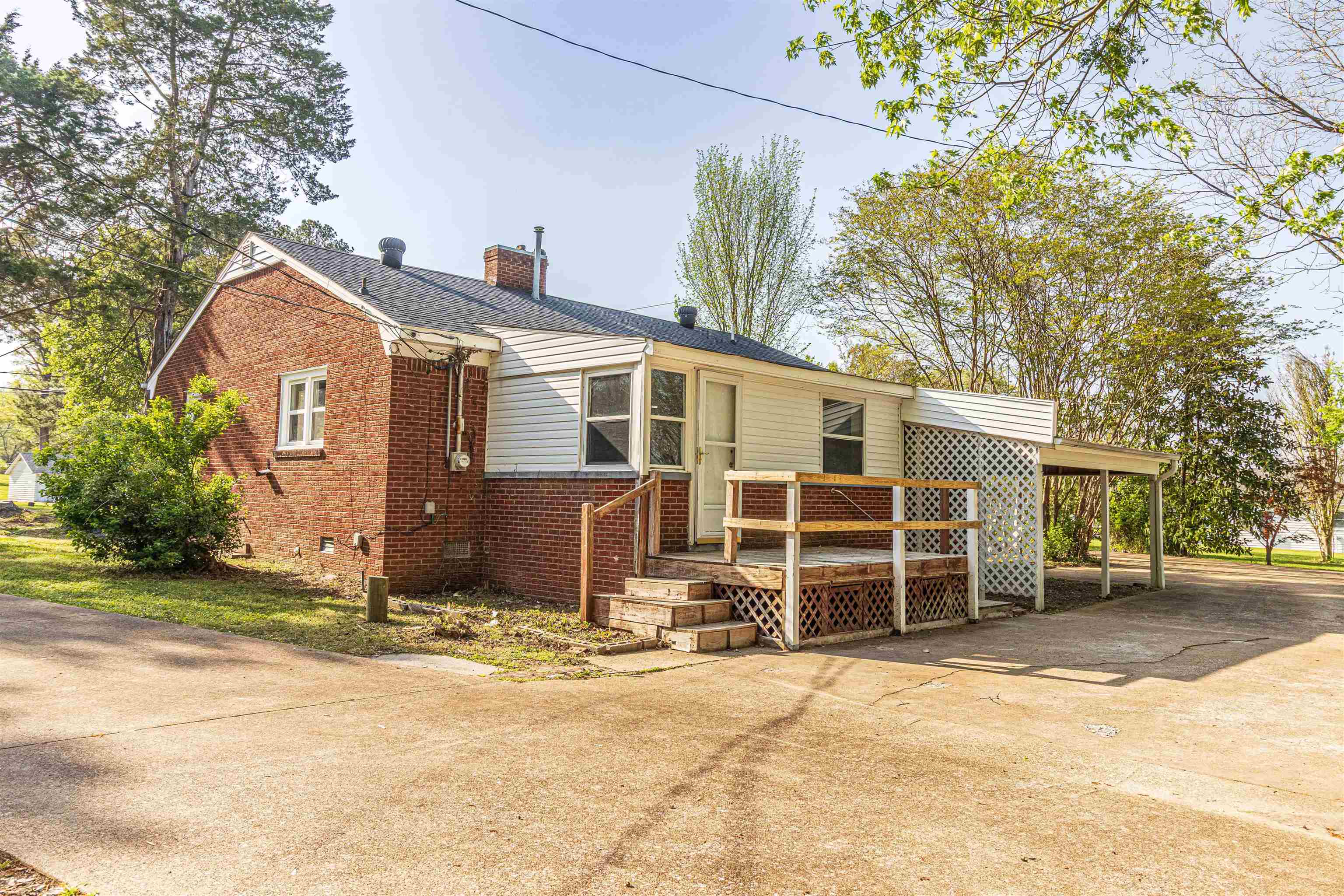212 North Maple Street Adamsville, TN 38310 - Photo 21 of 25 front view of a house with a yard