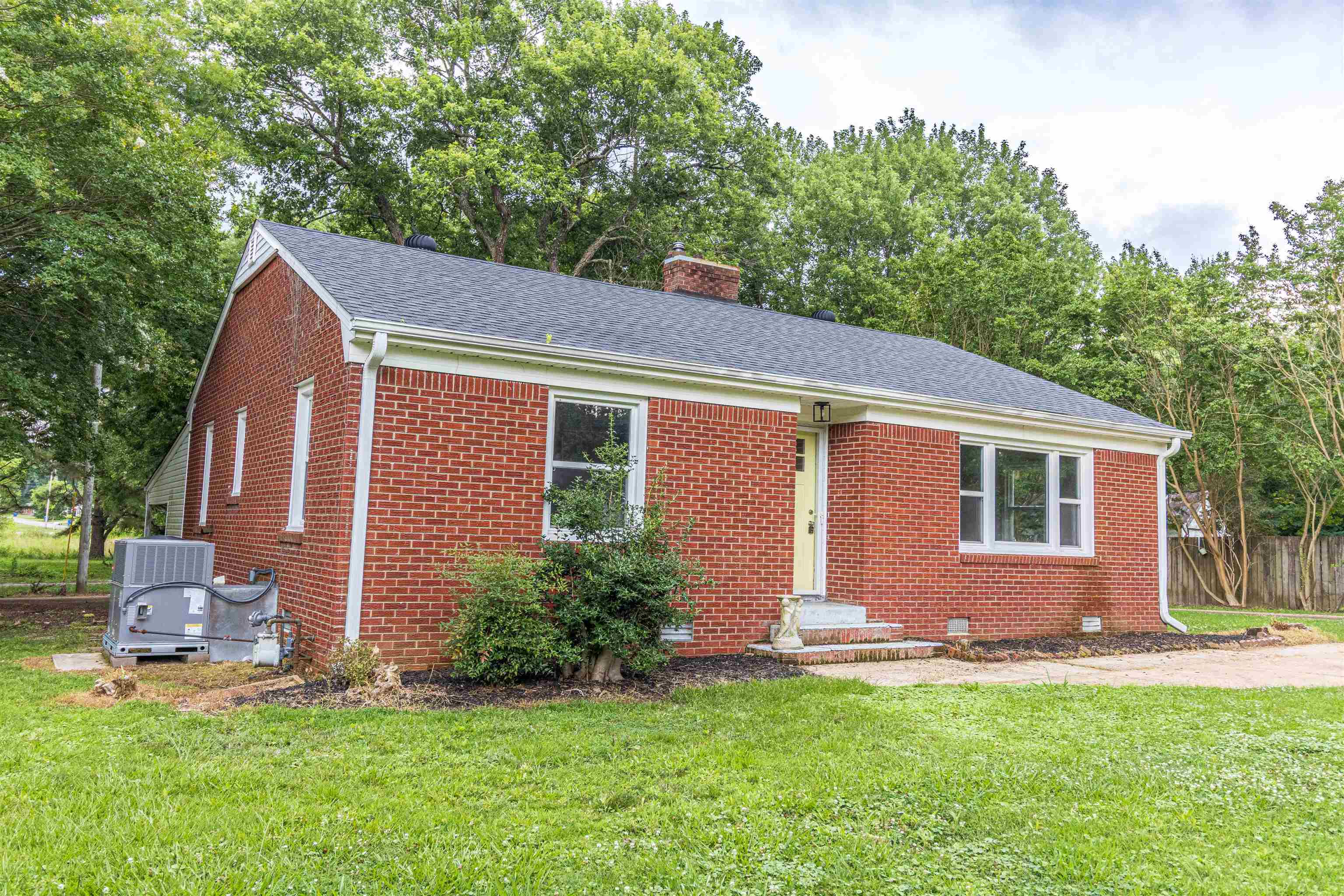 212 North Maple Street Adamsville, TN 38310 - Photo 25 of 25 a backyard of a house with table and chairs