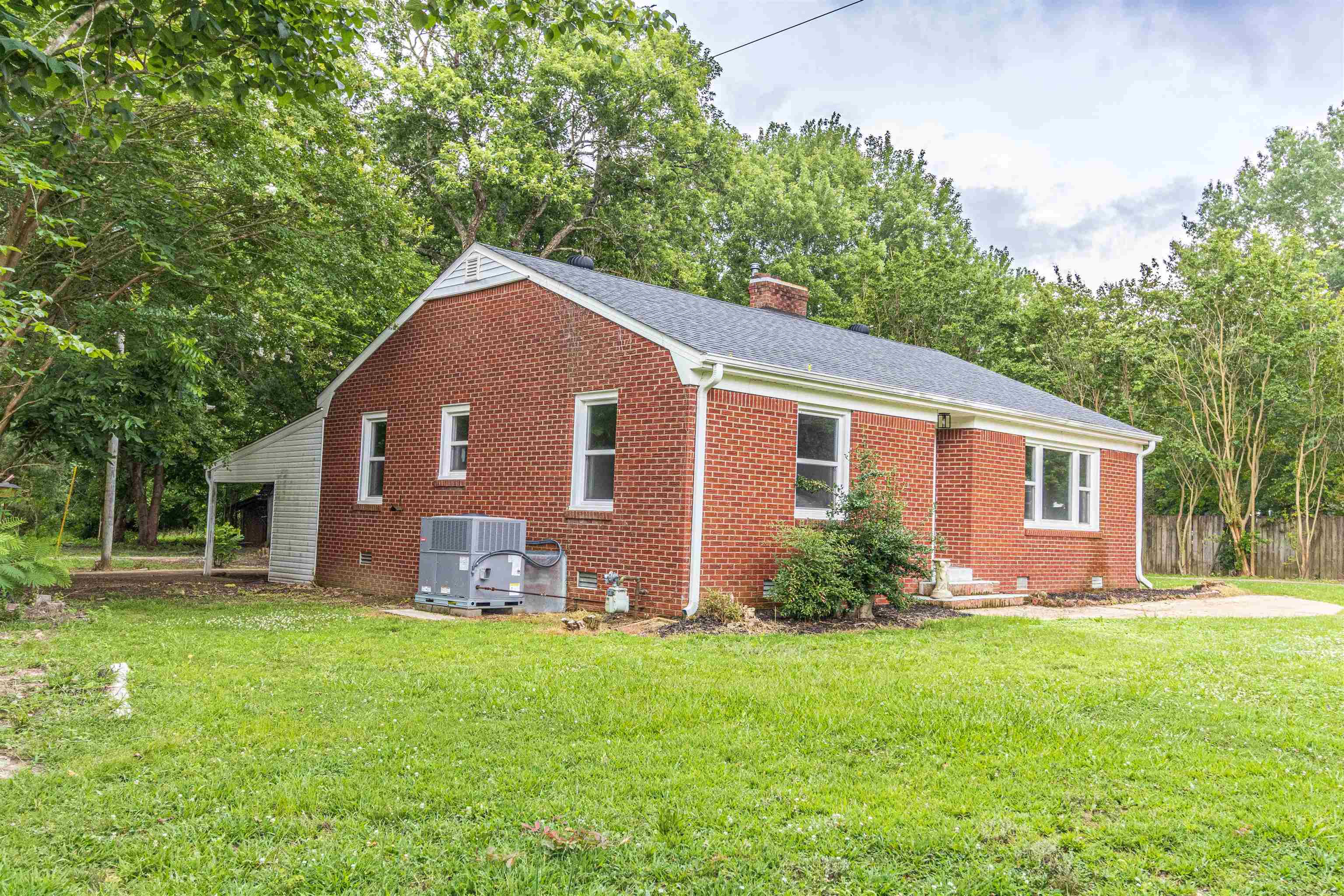 212 North Maple Street Adamsville, TN 38310 - Photo 3 of 25 a front view of house with yard and green space