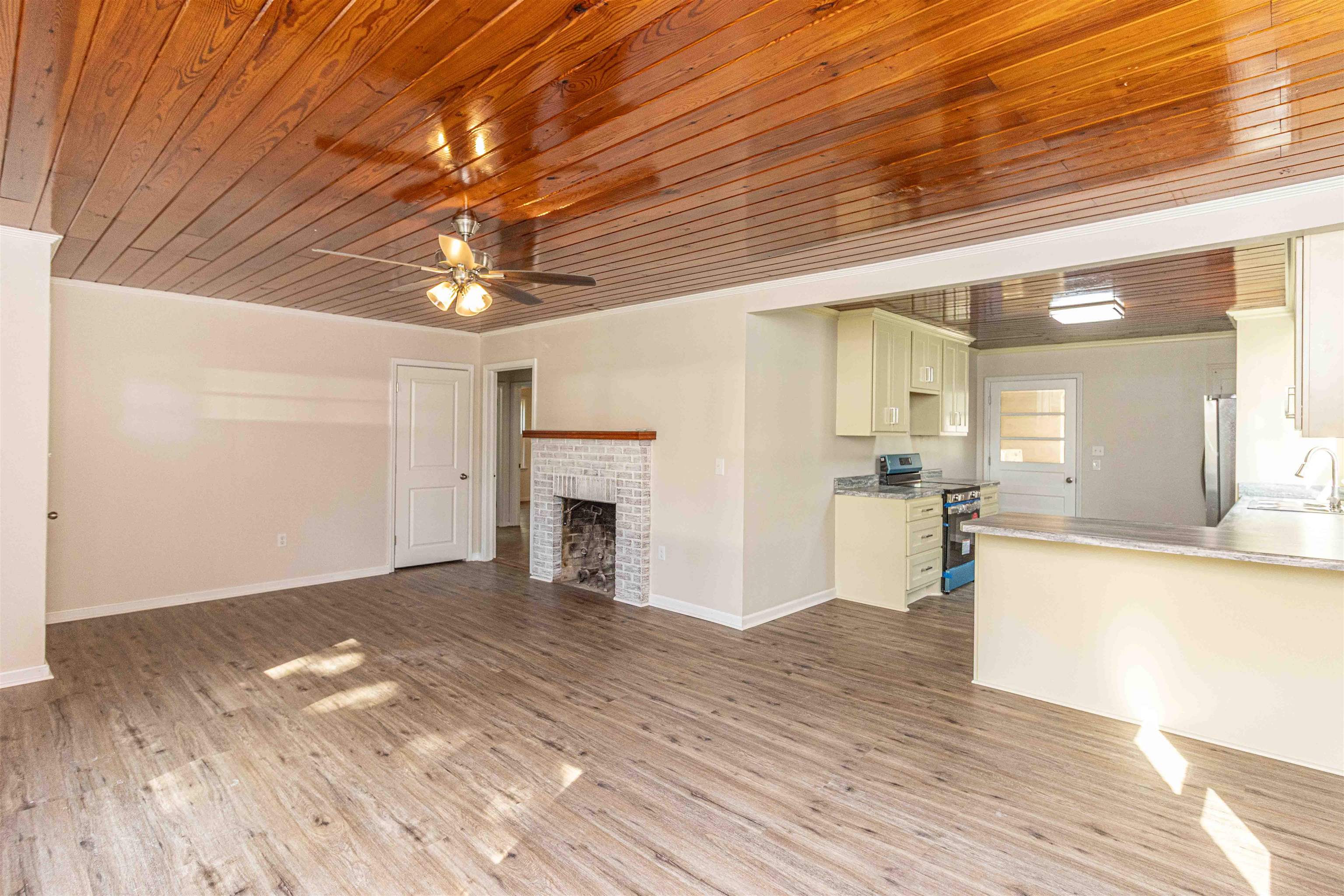 212 North Maple Street Adamsville, TN 38310 - Photo 5 of 25 a view of a livingroom with a fireplace