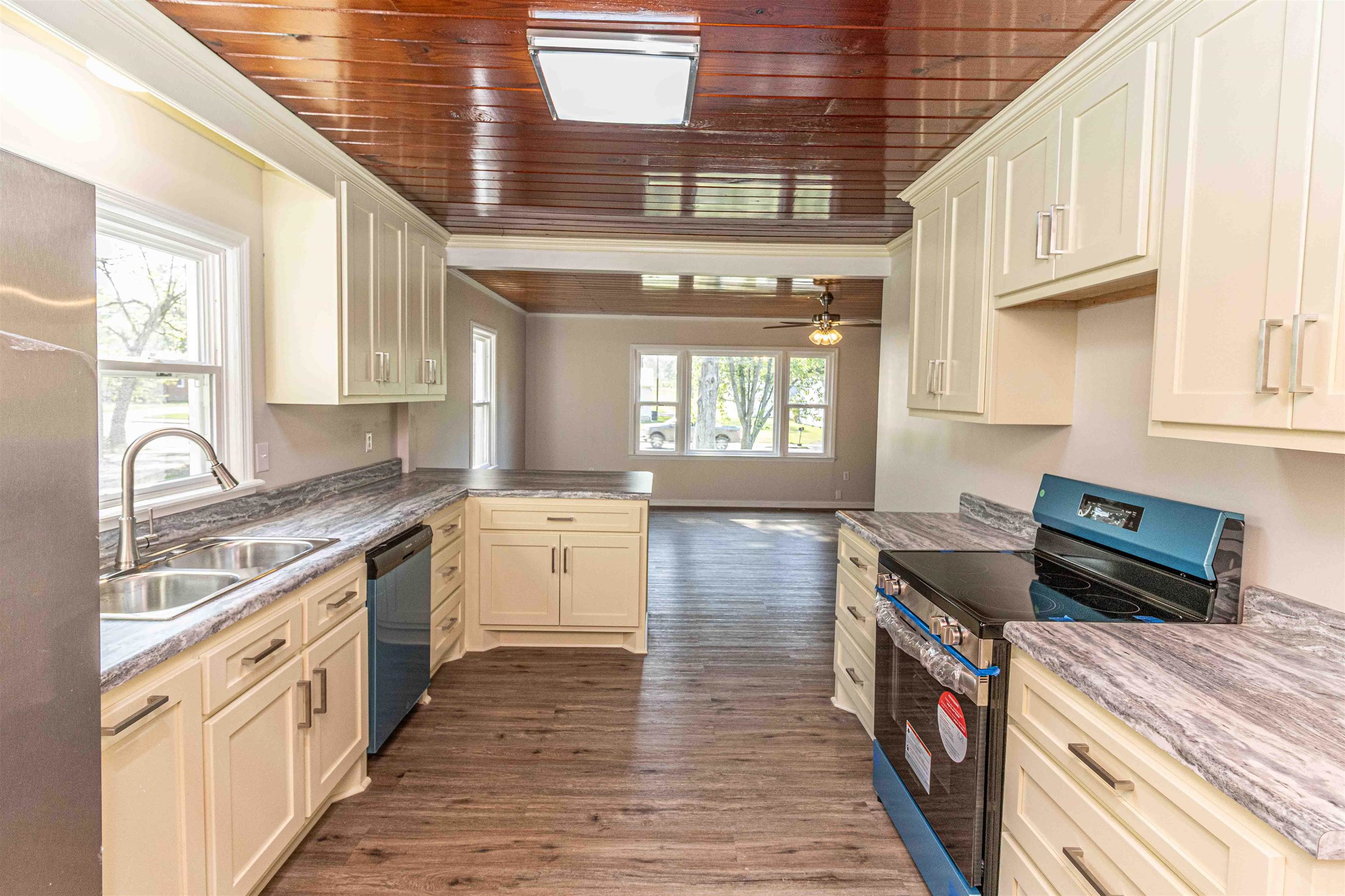 212 North Maple Street Adamsville, TN 38310 - Photo 9 of 25 a kitchen with a stove and a sink