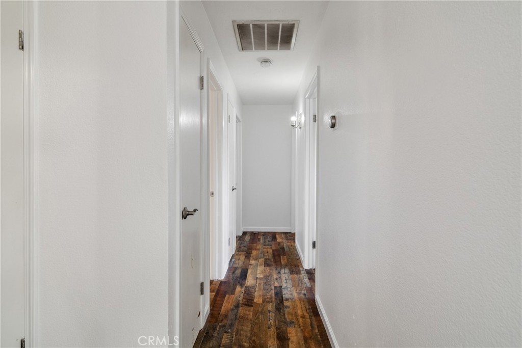 3157 Juneau Court Merced, CA 95348 - Photo 13 of 26 a view of a hallway with a small yard