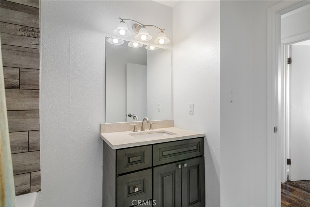 3157 Juneau Court Merced, CA 95348 - Photo 15 of 26 a bathroom with a sink and a mirror