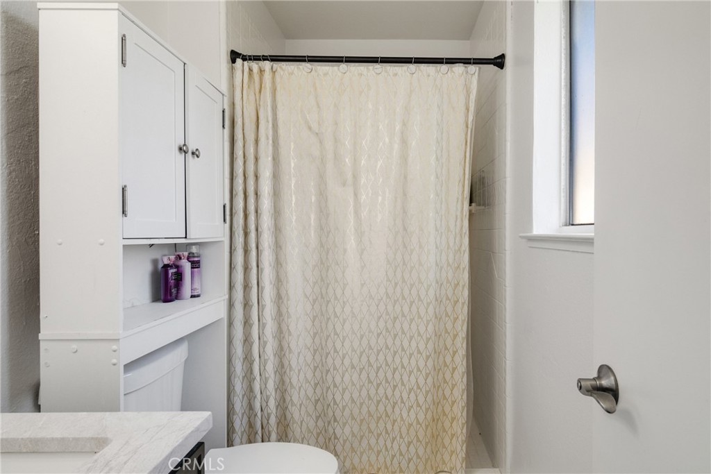 3157 Juneau Court Merced, CA 95348 - Photo 18 of 26 a bathroom with a sink and a mirror