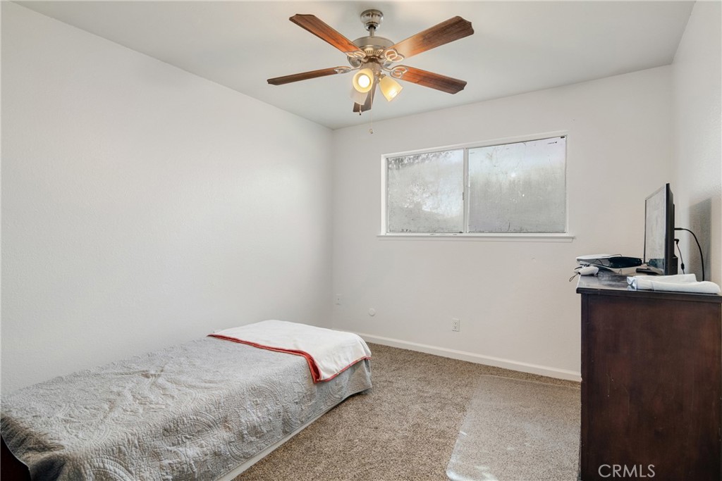 3157 Juneau Court Merced, CA 95348 - Photo 19 of 26 a bedroom with a bed and a table