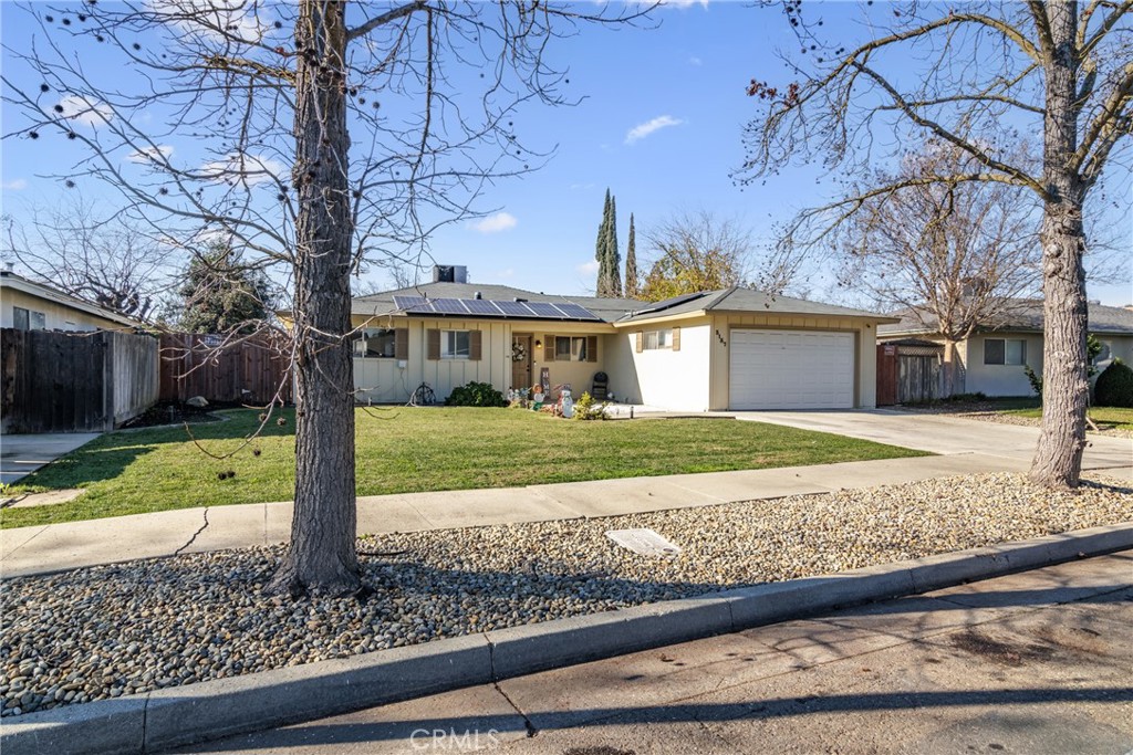 3157 Juneau Court Merced, CA 95348 - Photo 2 of 26 a front view of a house with a yard and large tree