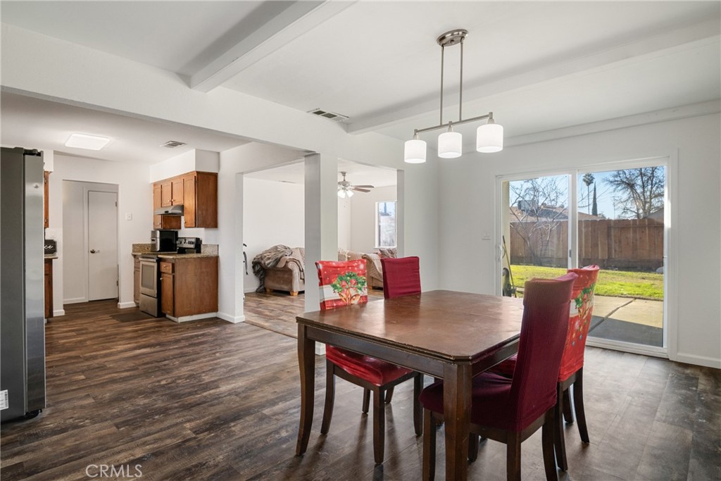 3157 Juneau Court Merced, CA 95348 - Photo 9 of 26 a view of a dining room with furniture window and wooden floor